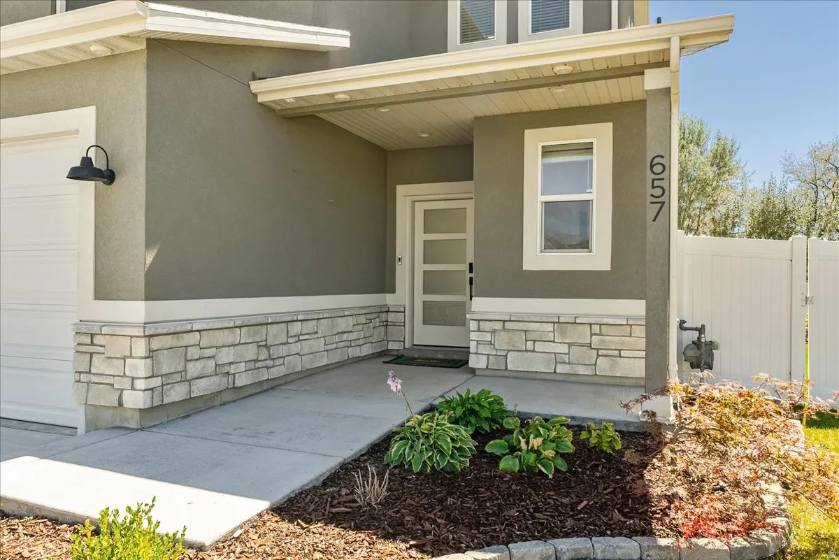 Stucco exterior with a stone veneer accent