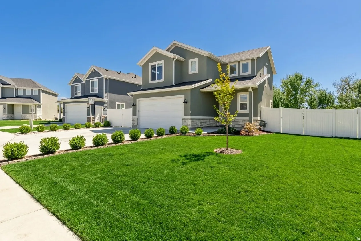 Contemporary two-story exterior with stucco siding and stone accents