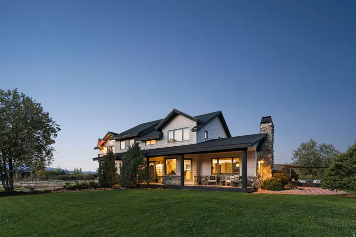 Expansive lawn with mature trees and landscaping