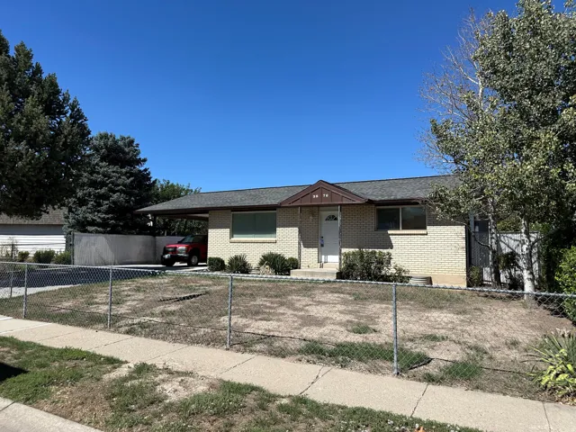Brick-clad exterior with a covered carport