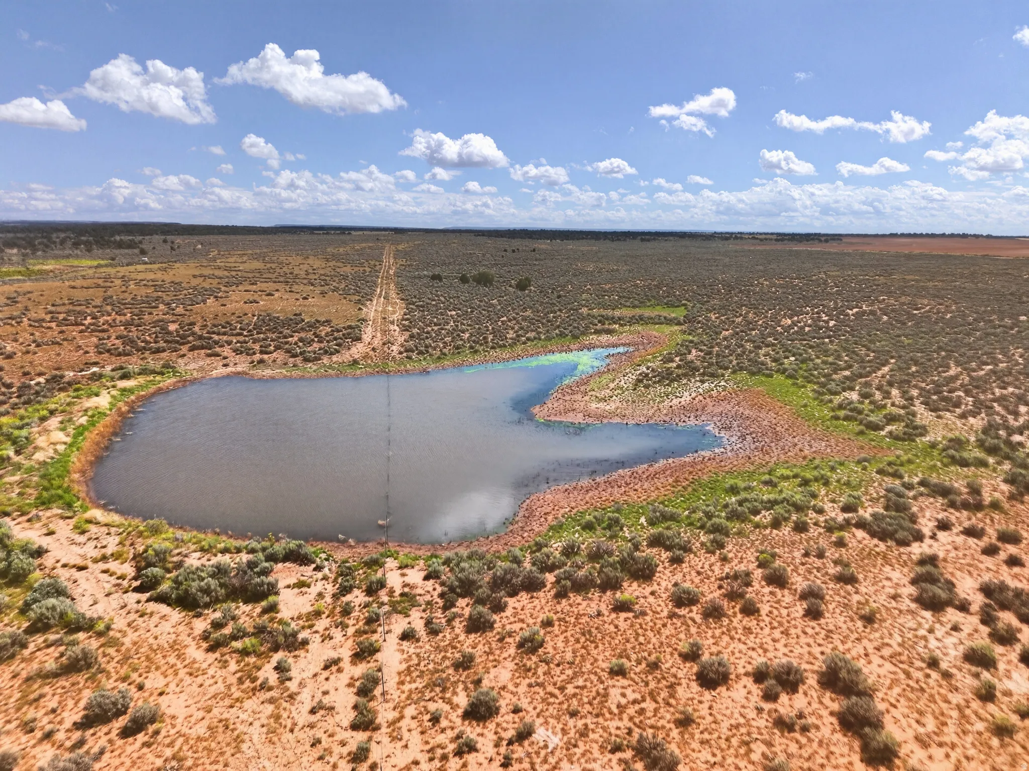 stock pond halfway on property and half on neighbors property, north boundary west section