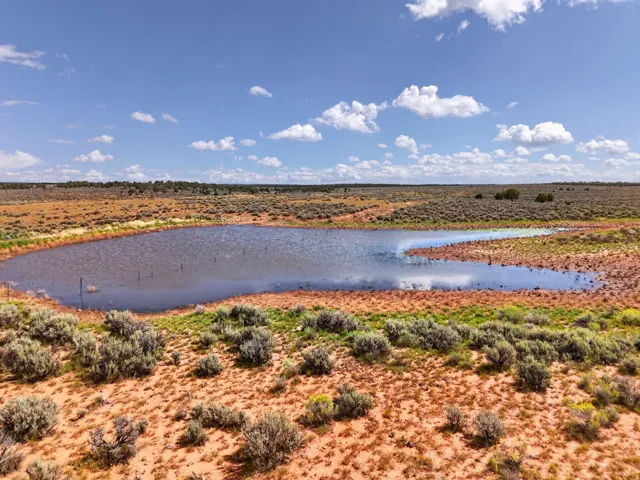 stock pond halfway on property and half on neighbors property, north boundary west section