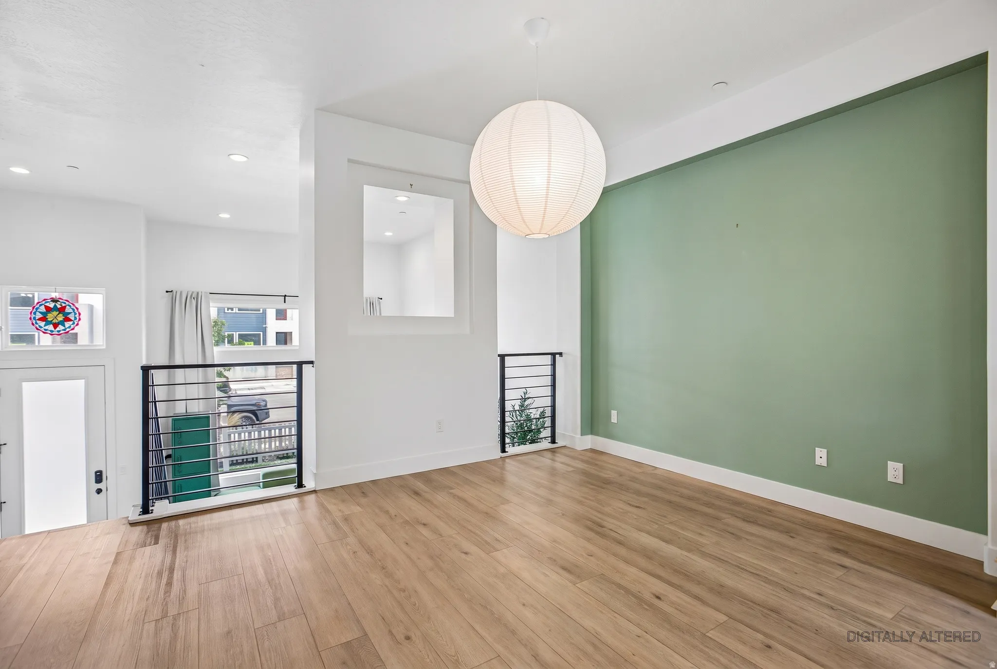 High ceilings complement the wood-finish flooring