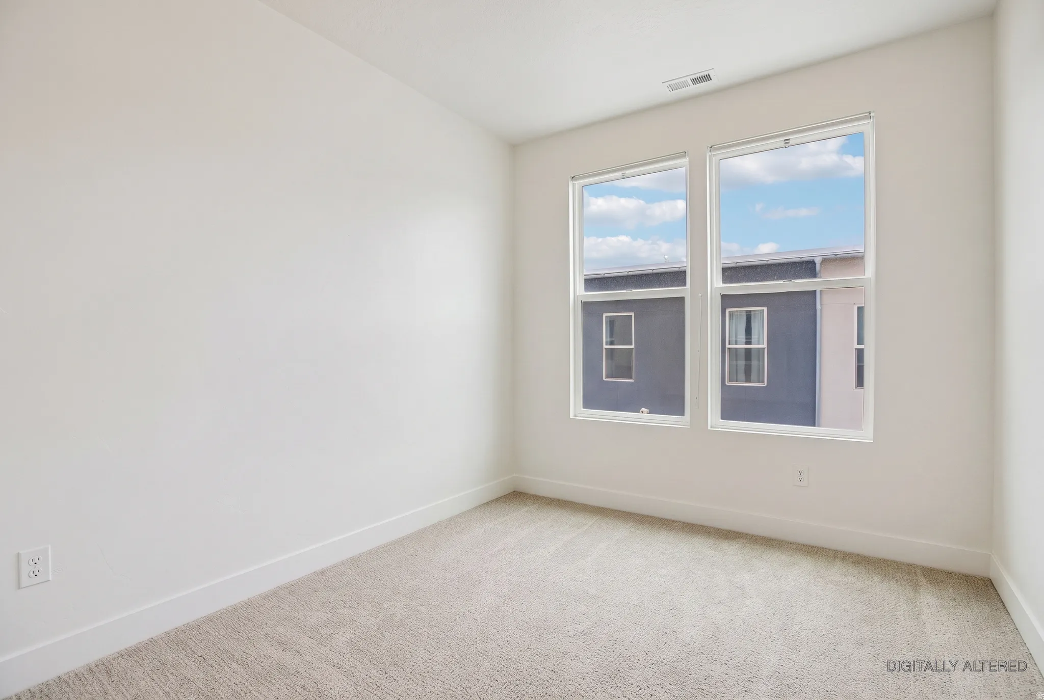 Light-colored carpeting with white walls and trim