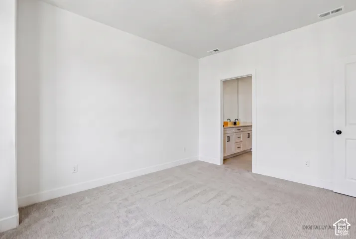 Plush carpet flooring and crisp white walls