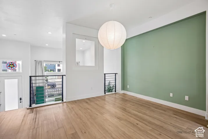 High ceilings complement the wood-finish flooring