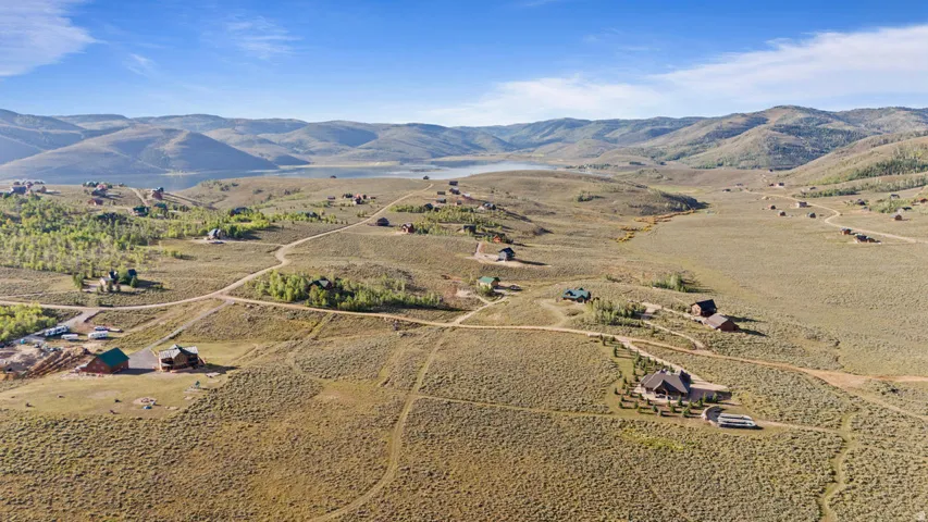 Expansive landscape featuring rolling hills and distant mountains