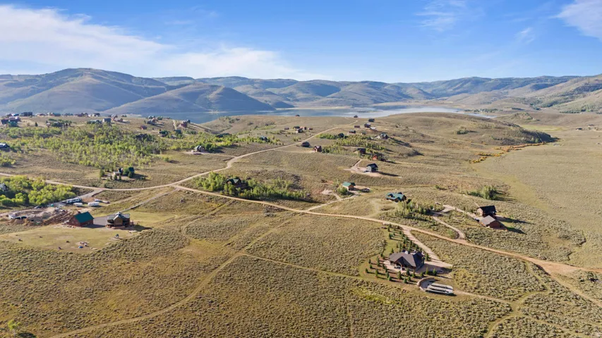 Expansive rural landscape featuring rolling hills and distant mountains