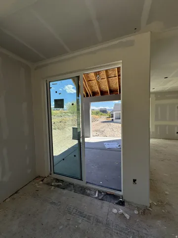 Sliding glass door leading to an outdoor concrete patio