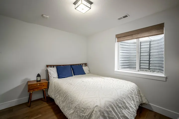 White walls with wood-finish flooring