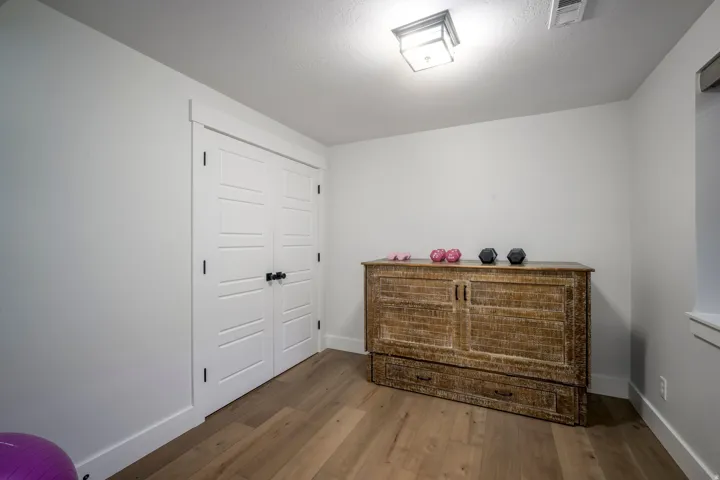 White walls with wood-finish flooring