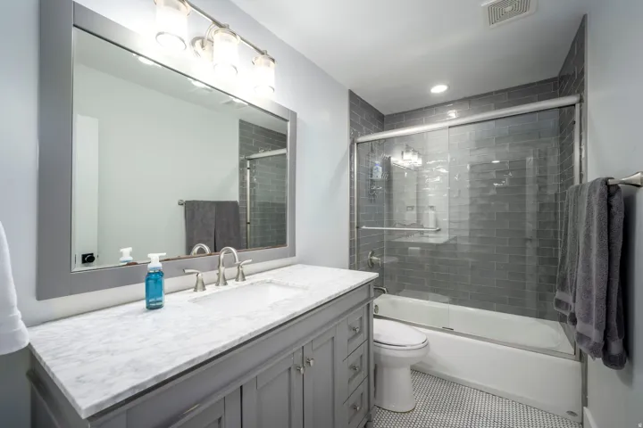 Gray vanity with a white countertop and undermount sink