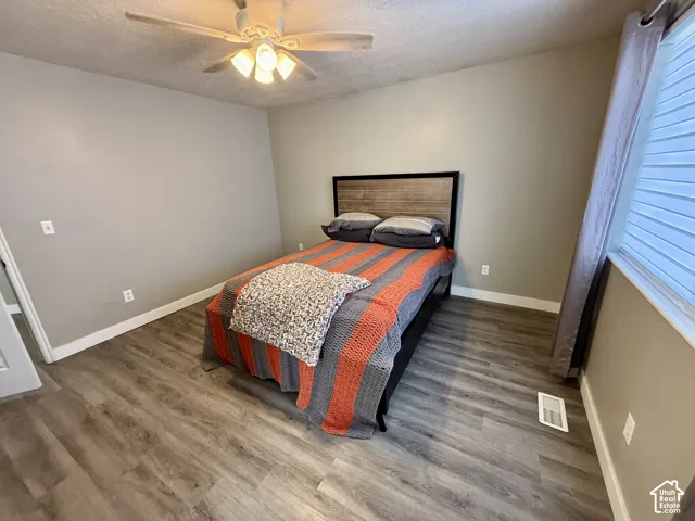 Wood-finish flooring with baseboard trim