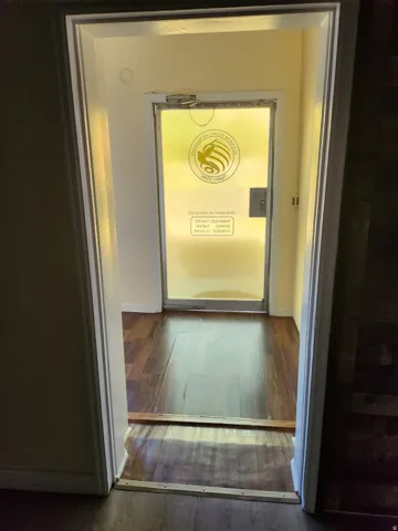 Wood-finish flooring with baseboard trim
