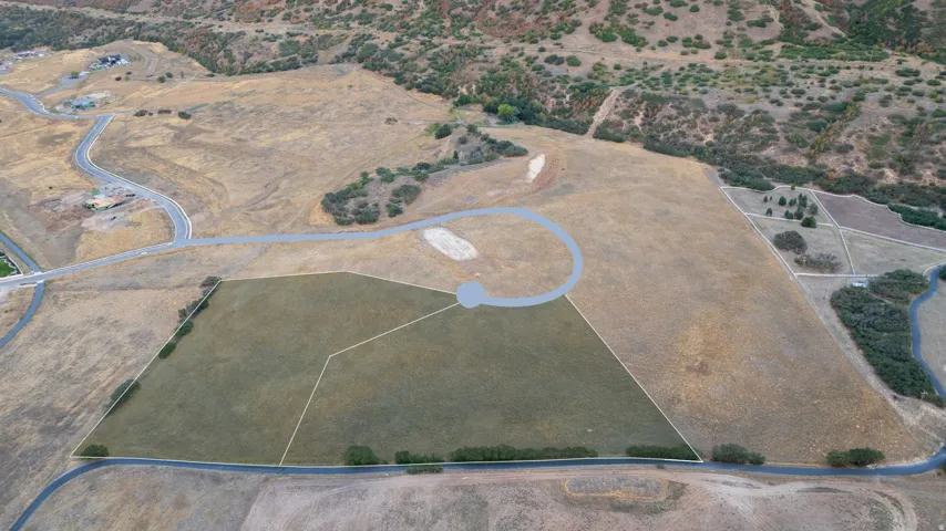 Expansive land parcel featuring defined lot lines and direct road access