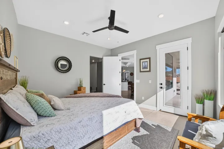 Recessed lighting, ceiling fan, white paneled doors, full-light exterior door, and light-toned flooring