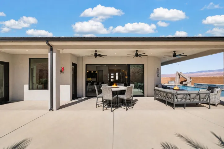 Expansive covered patio with recessed lighting and ceiling fans