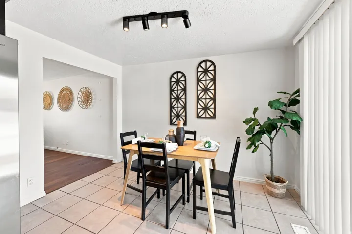 Recessed lighting, tile flooring, and a wide entryway