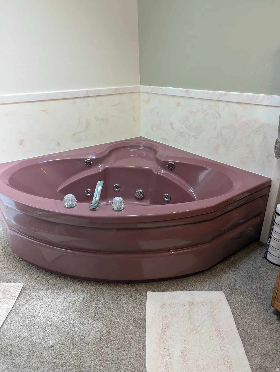 Corner soaking tub with integrated jets and chrome fixtures