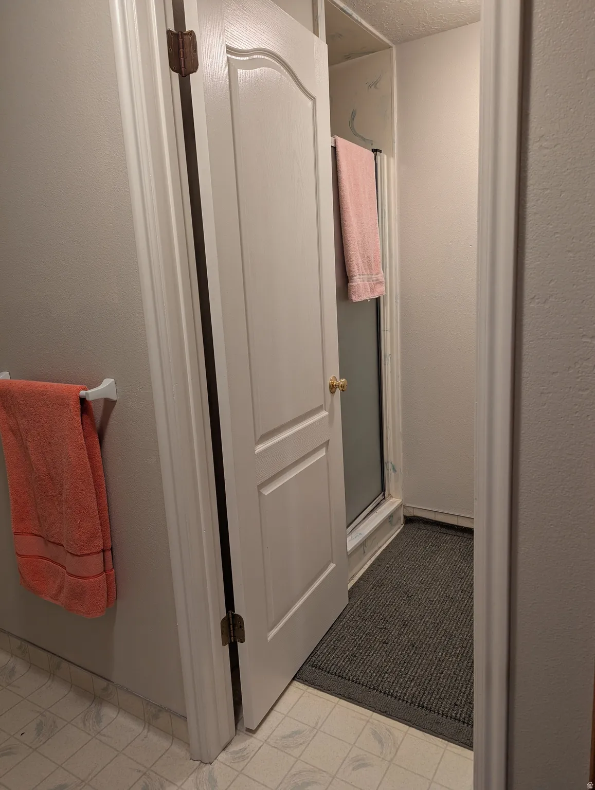 White painted interior door with arch panel detailing