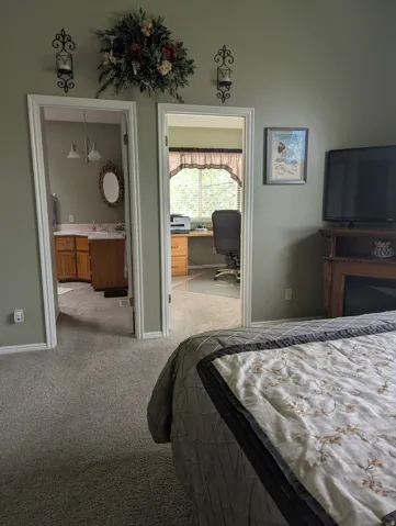 Carpeted flooring extending into two separate doorways