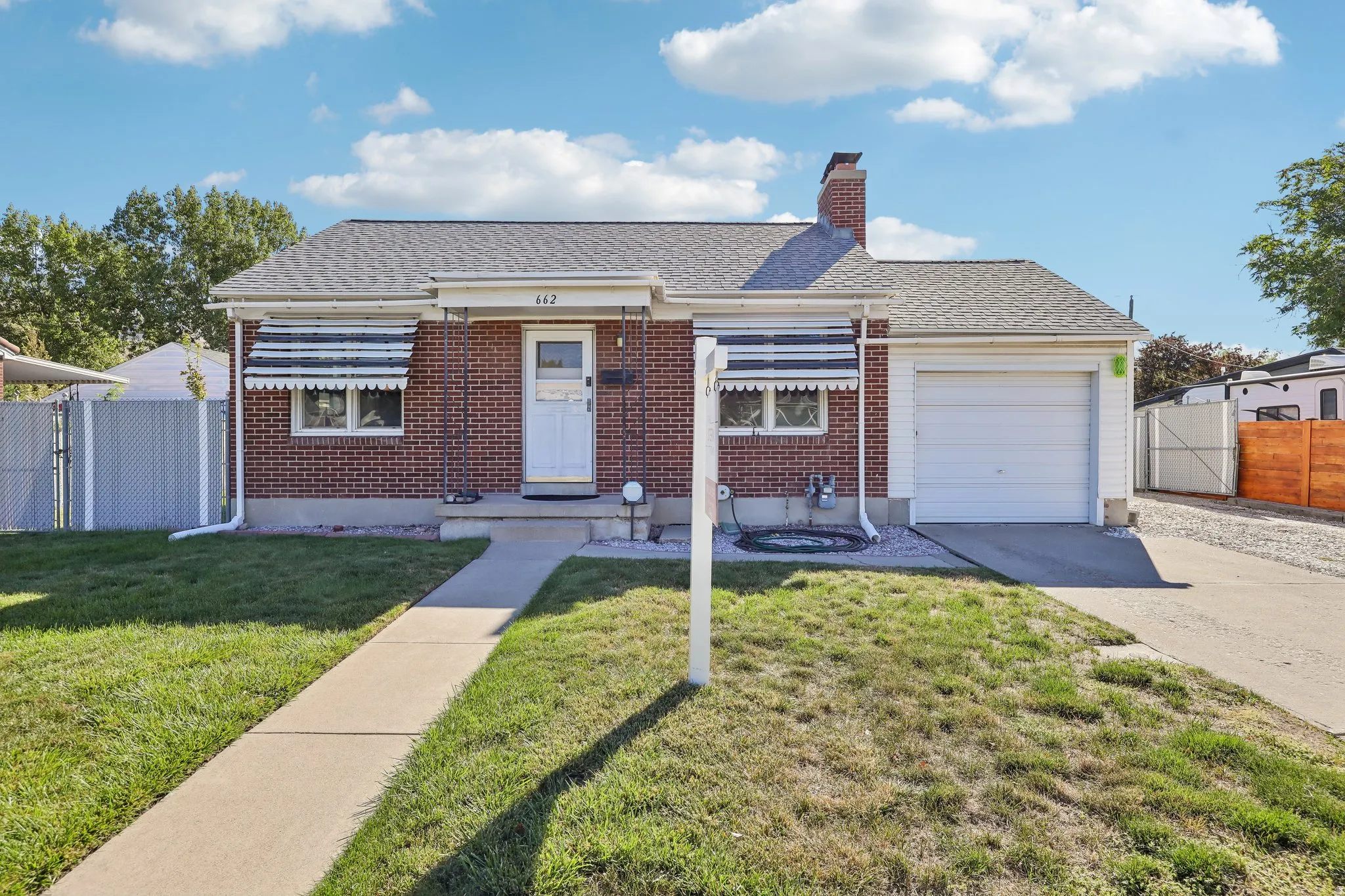 Brick exterior with a gabled roof and front porch