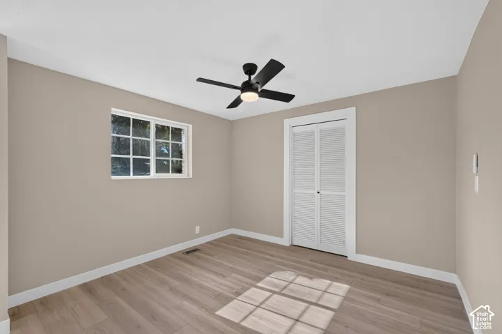 Neutral wall palette with wood-finish flooring