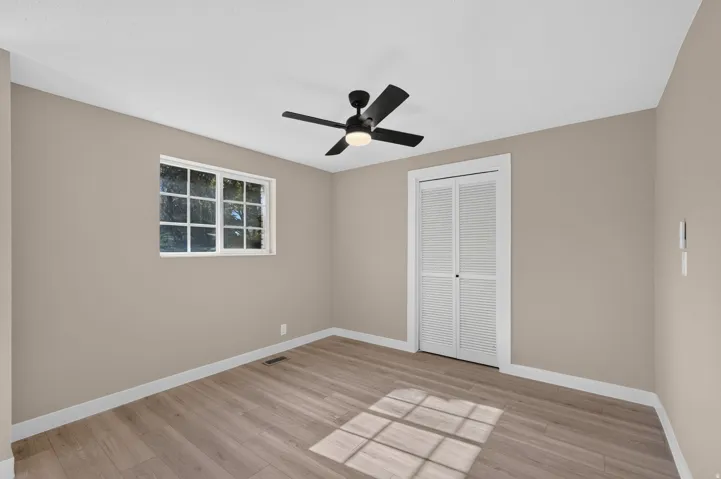 Neutral wall palette with wood-finish flooring