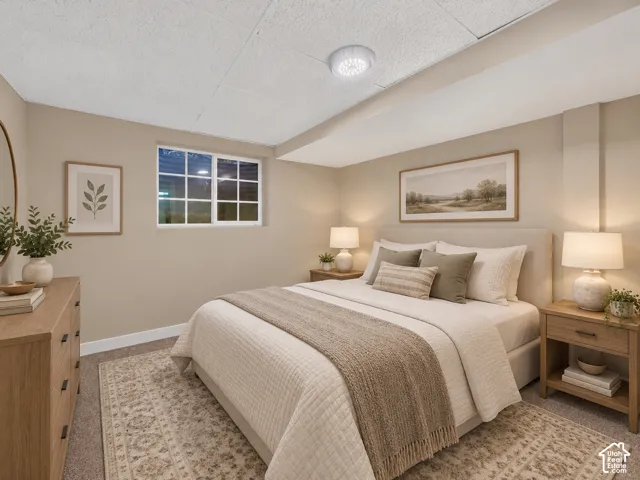 Window with grid pattern, neutral wall tones, carpeted flooring, white ceiling panels, and recessed lighting