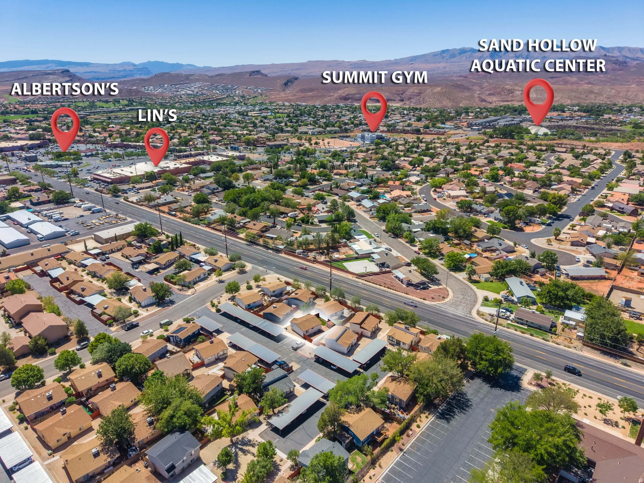 Aerial overview of a residential area featuring multiple commercial establishments, including Albertson's and Lin's