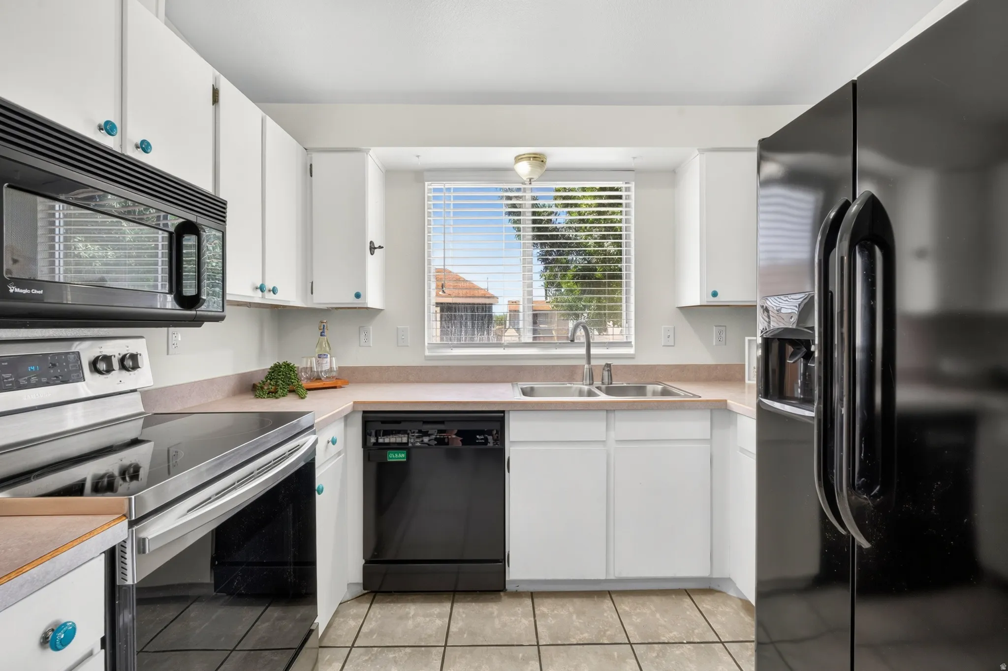 White cabinetry with accent knobs
