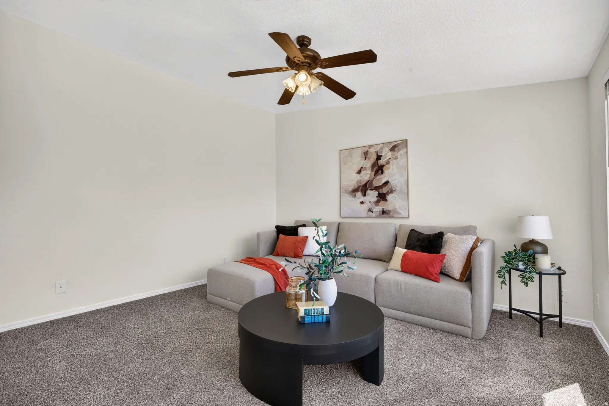 Neutral wall finishes with a ceiling fan light fixture