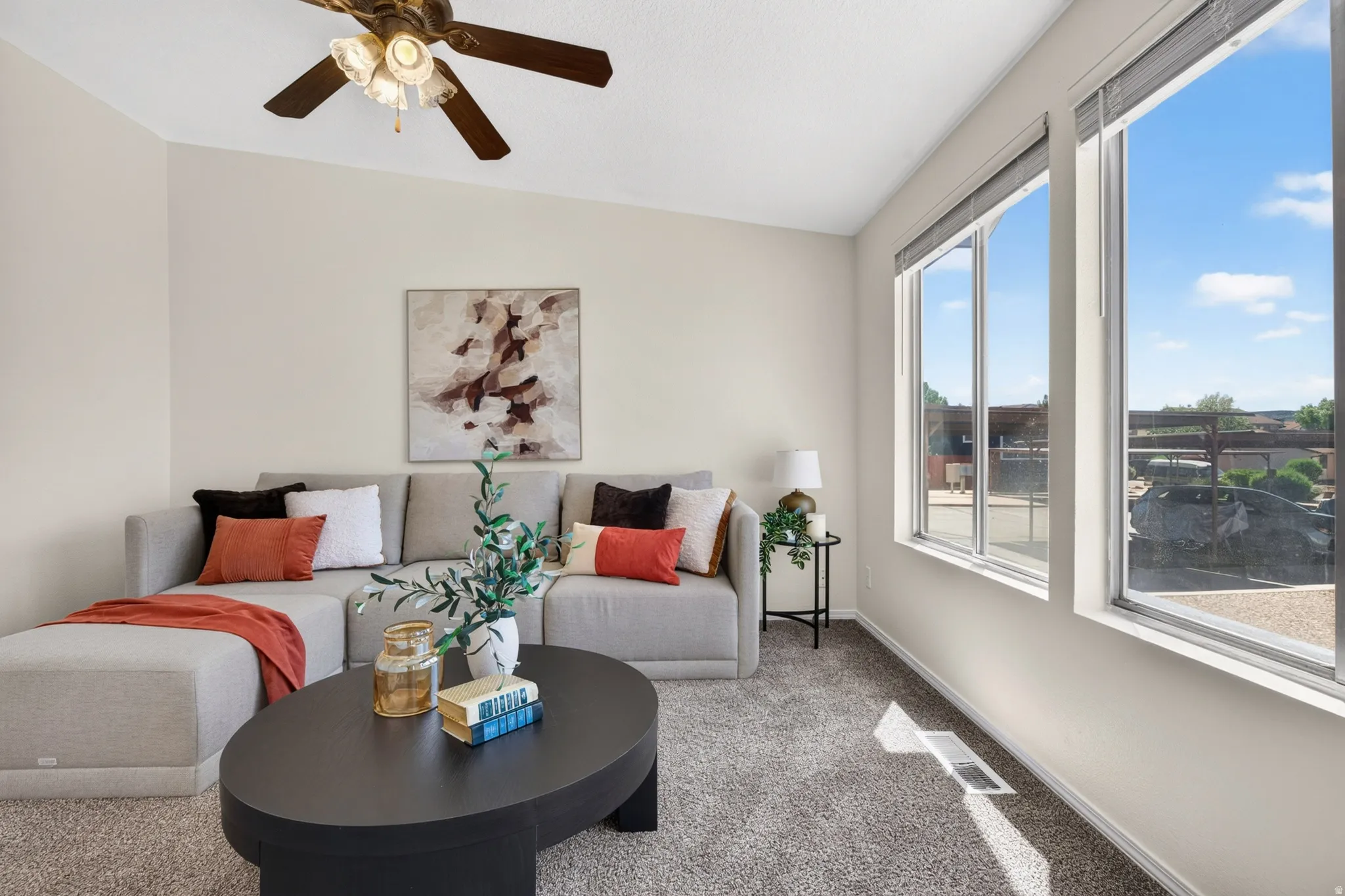 Recessed lighting, ceiling fan, and carpeted flooring