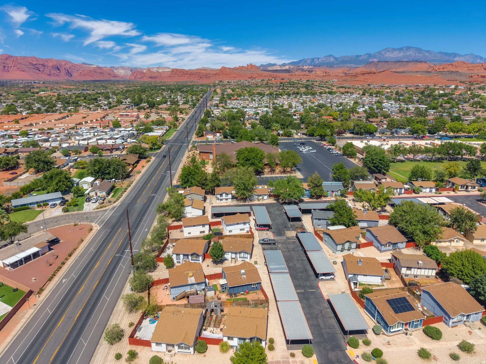 Residential community featuring individual homes and covered parking structures