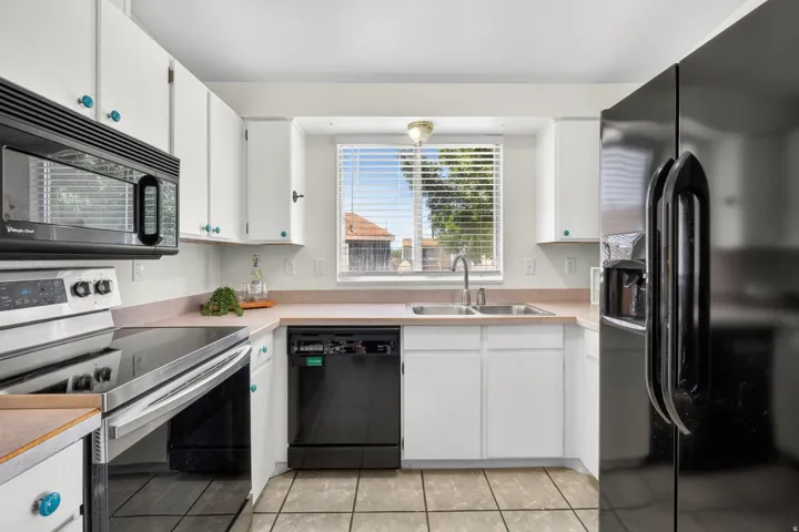 White cabinetry with accent knobs