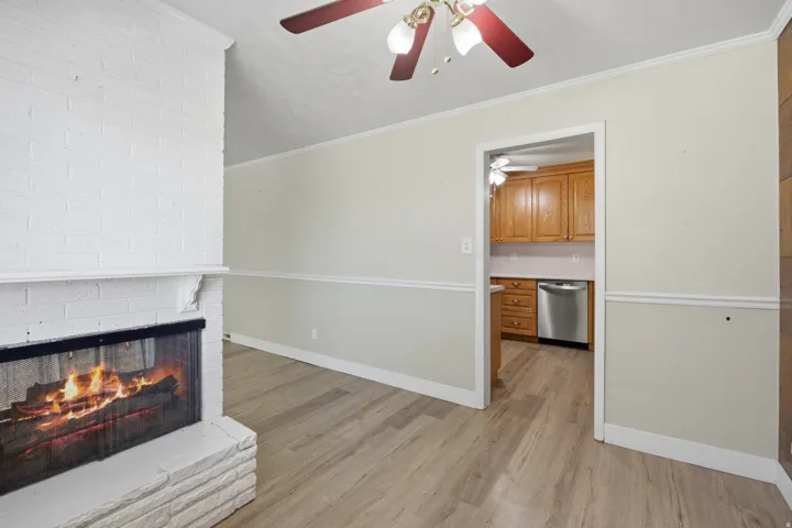 Spacious living room with welcoming fireplace