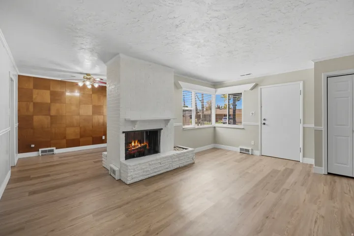 Spacious living room with welcoming fireplace
