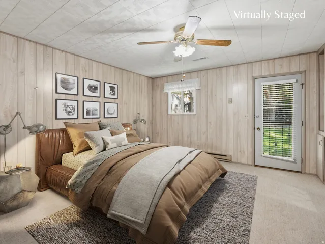 Primary bedroom with separate sitting area, ensuite bathroom, full wall of closets and direct access to the backyard.  Virtually staged image