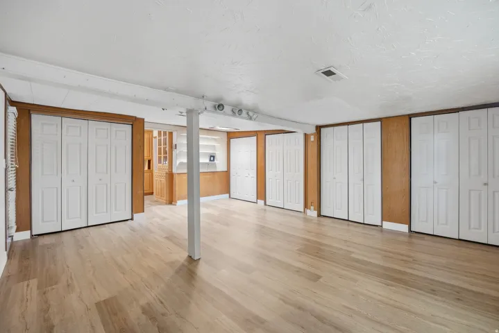 Large family room with lots of storage, LVP flooring and door for access to the backyard