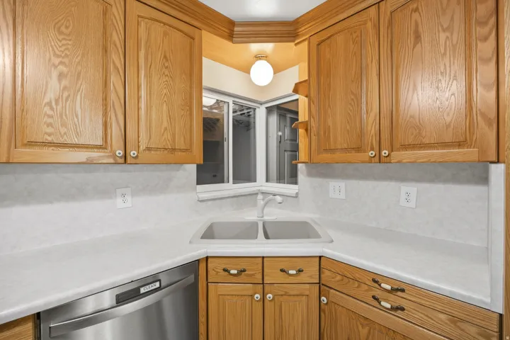Cozy kitchen with lots of storage, stainless steel range and dishwasher and LVP flooring