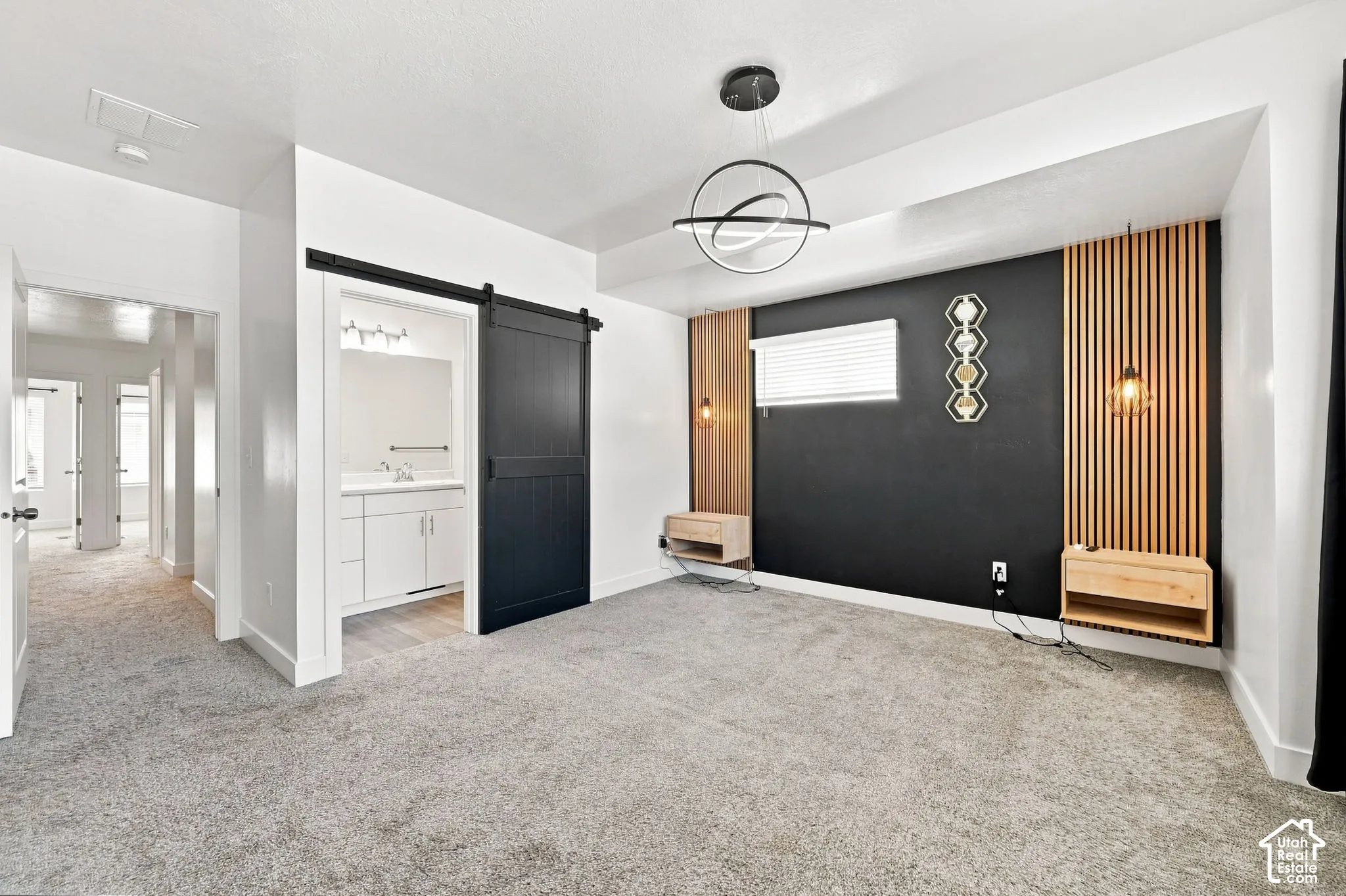 Accent wall with vertical wood paneling and integrated lighting