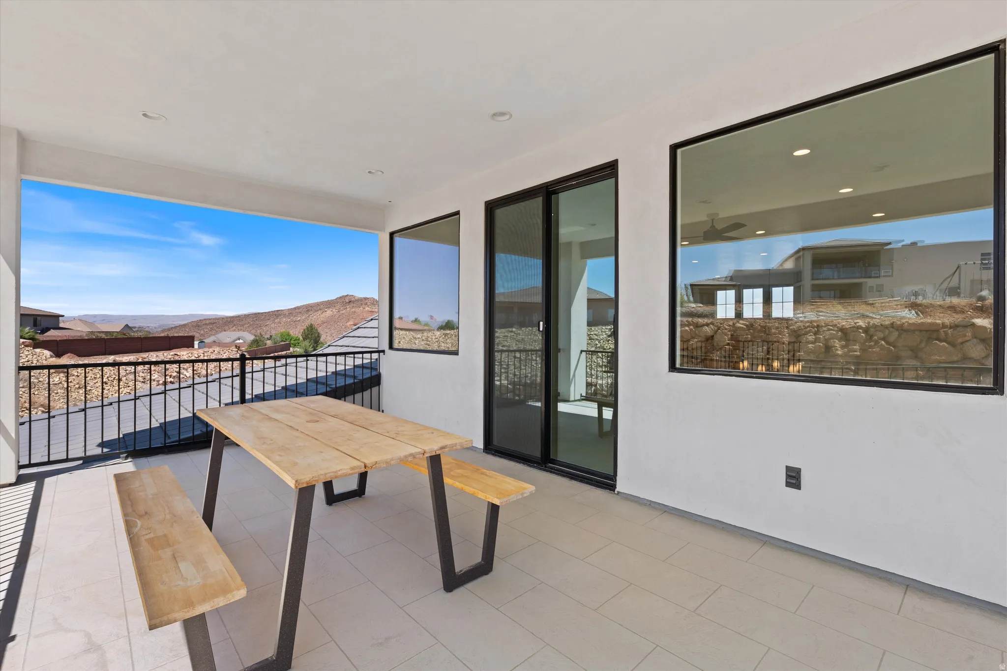 Covered outdoor patio with tiled flooring