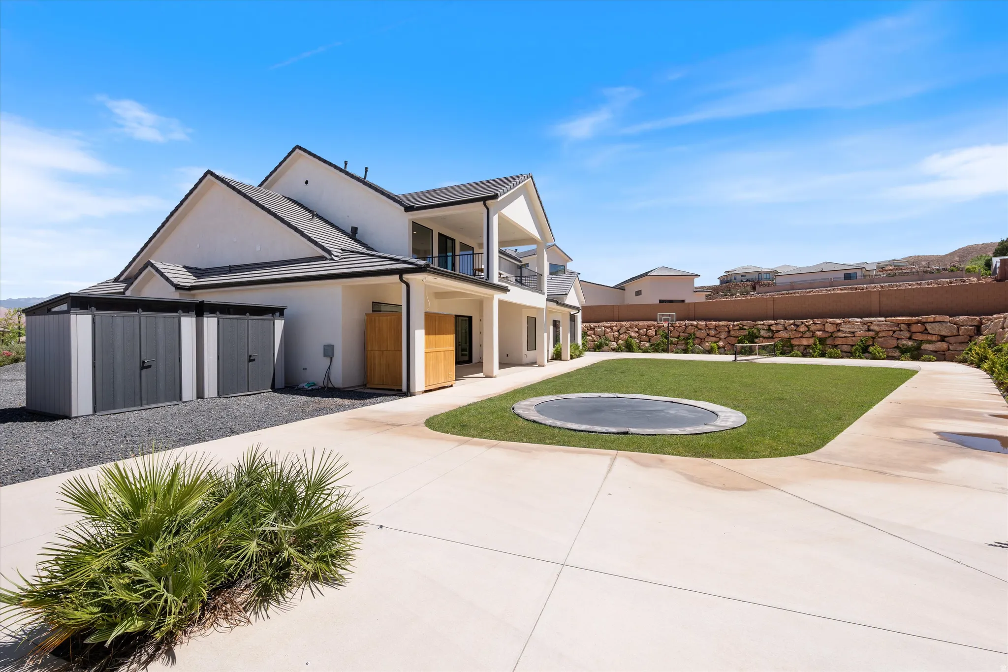 Modern home showcasing a striking contemporary exterior with peaked rooflines, mixed material cladding, and large windows