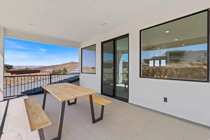 Covered outdoor patio with tiled flooring