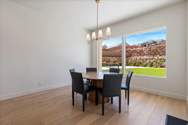 Light wood-finish flooring with white walls and trim