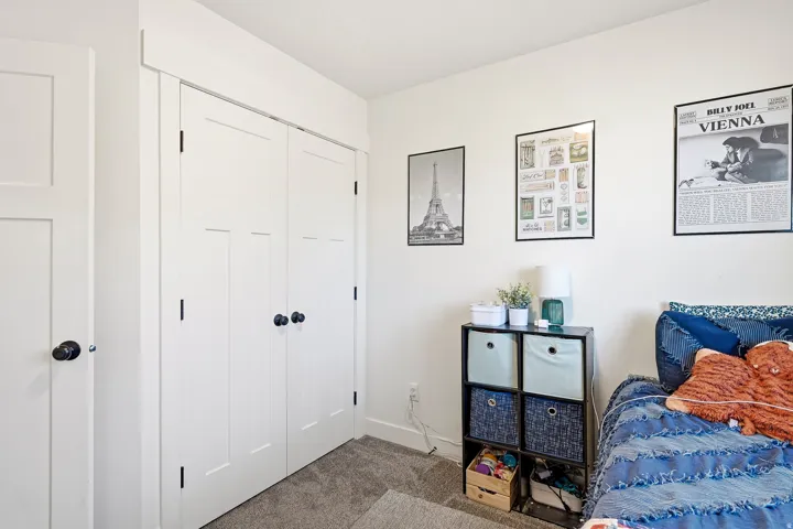 White paneled doors with black hardware