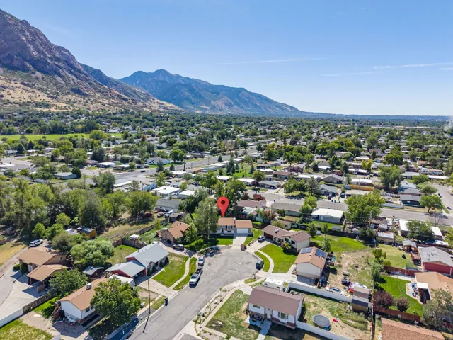 Expansive mountain backdrop with a residential neighborhood