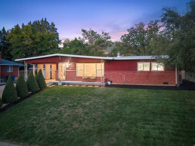 Red brick and siding exterior with a flat roofline
