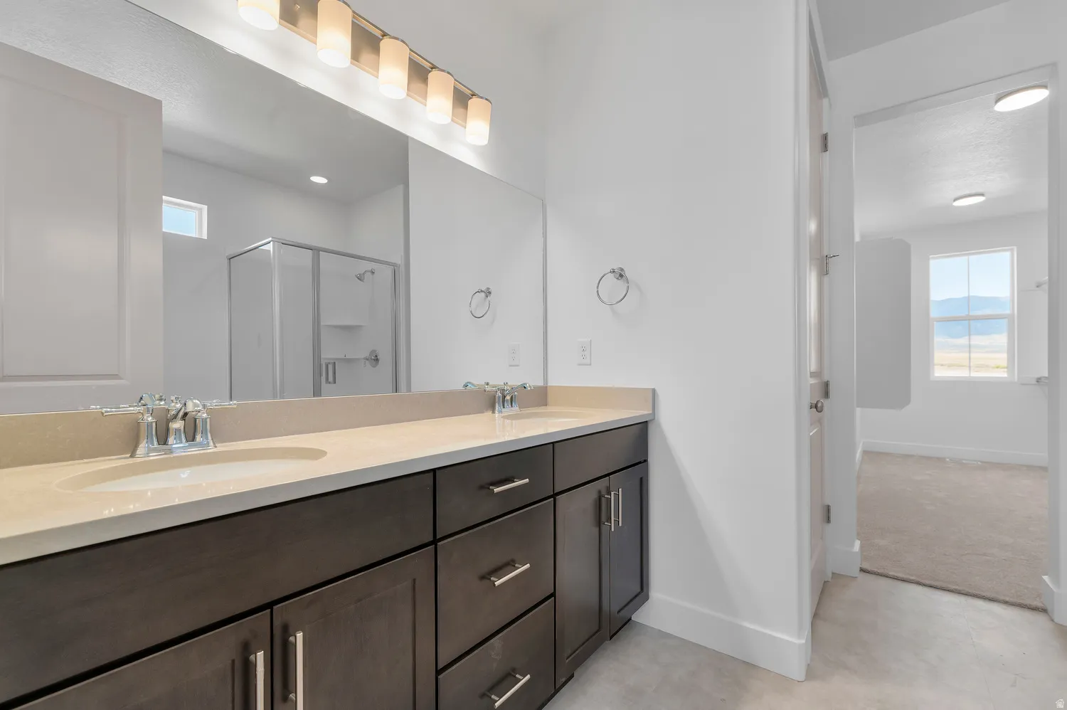 Dual vanity with undermount sinks and chrome fixtures