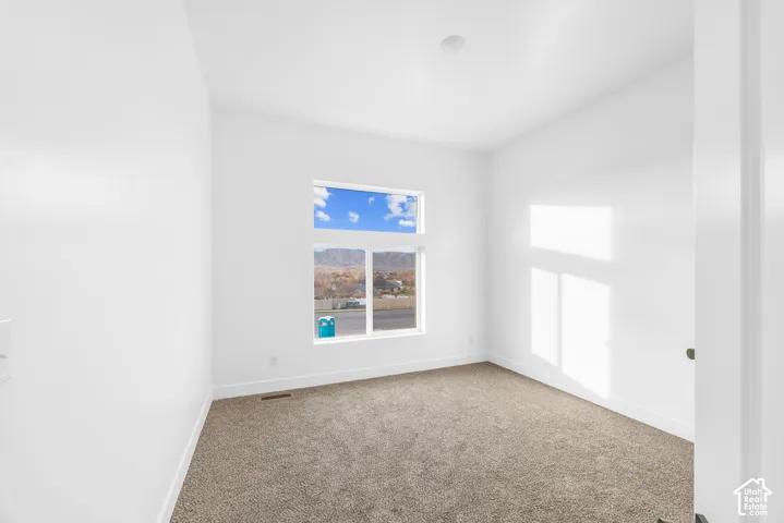 Neutral wall finishes and plush carpeting